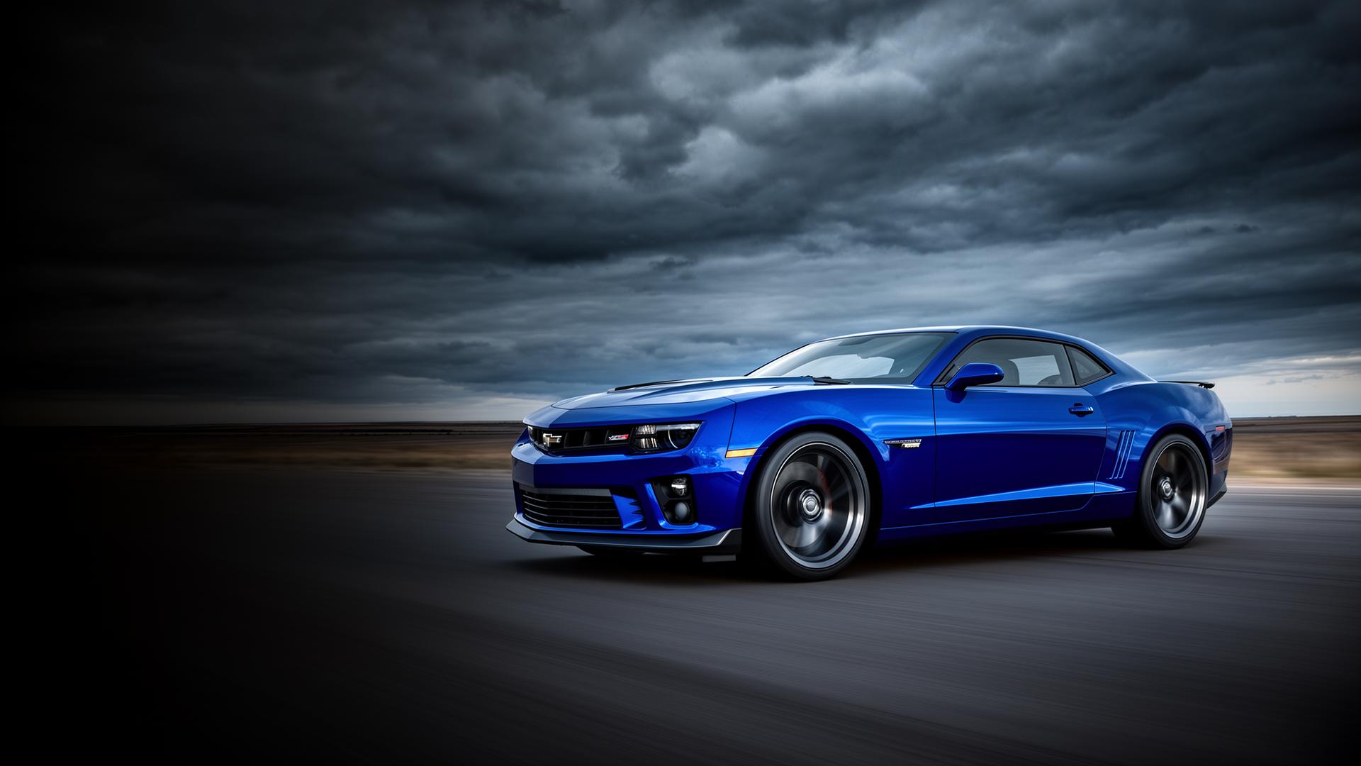 Blue sports car driving on open road in Curaçao